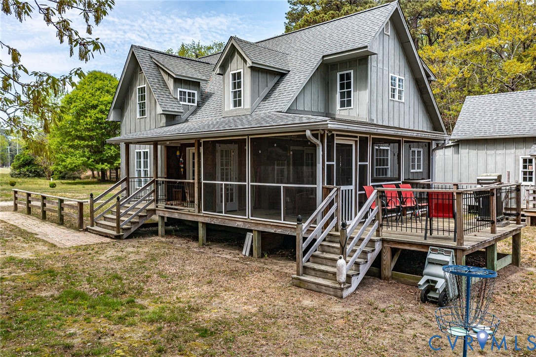 193 Deep Water Lane Reedville, VA 22539 - Photo 60 of 84 a view of a house with a balcony and wooden fence
