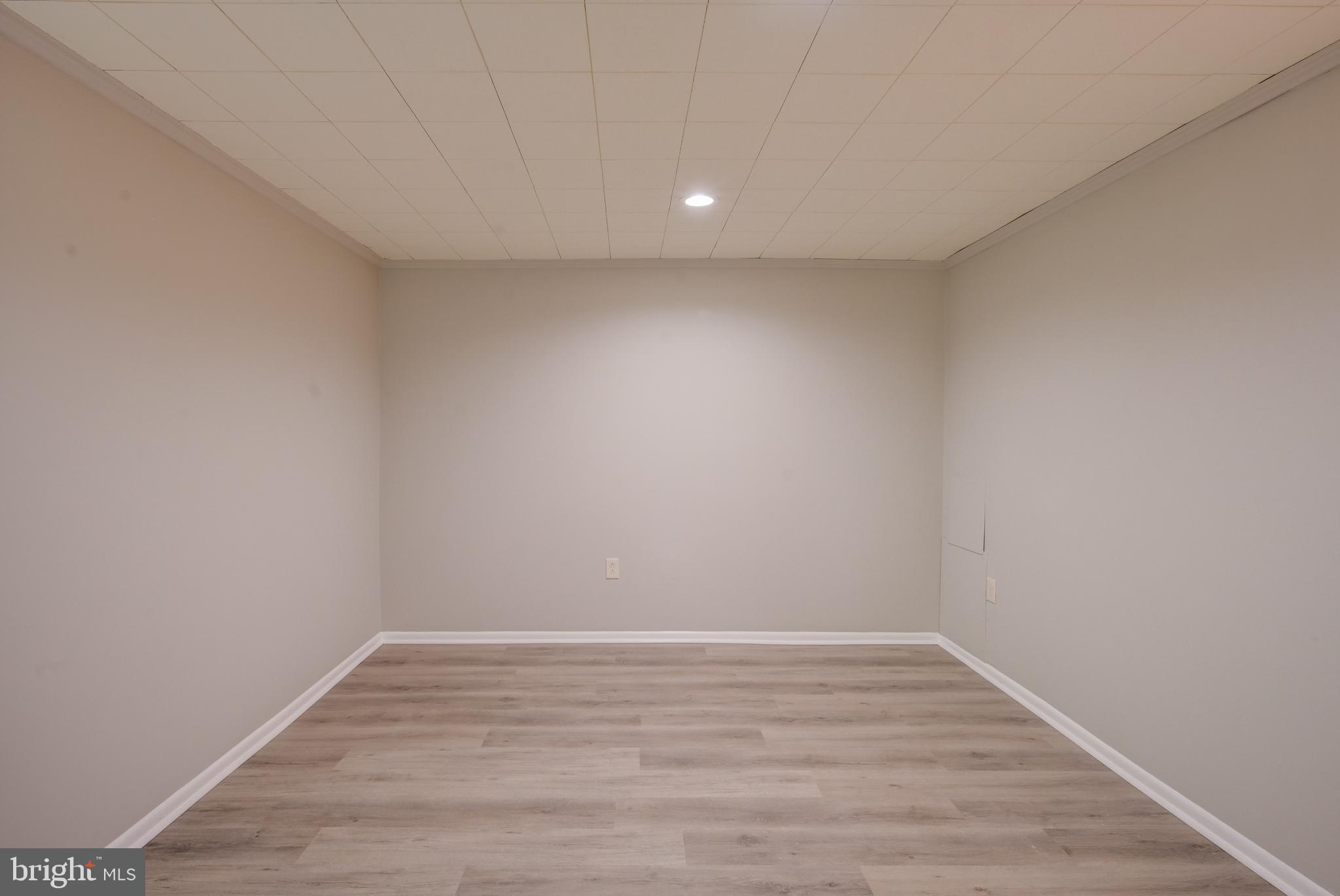 5241 West Running Brook Road, Unit 302 Columbia, MD 21044 - Photo 16 of 32 a view of room with wooden floor