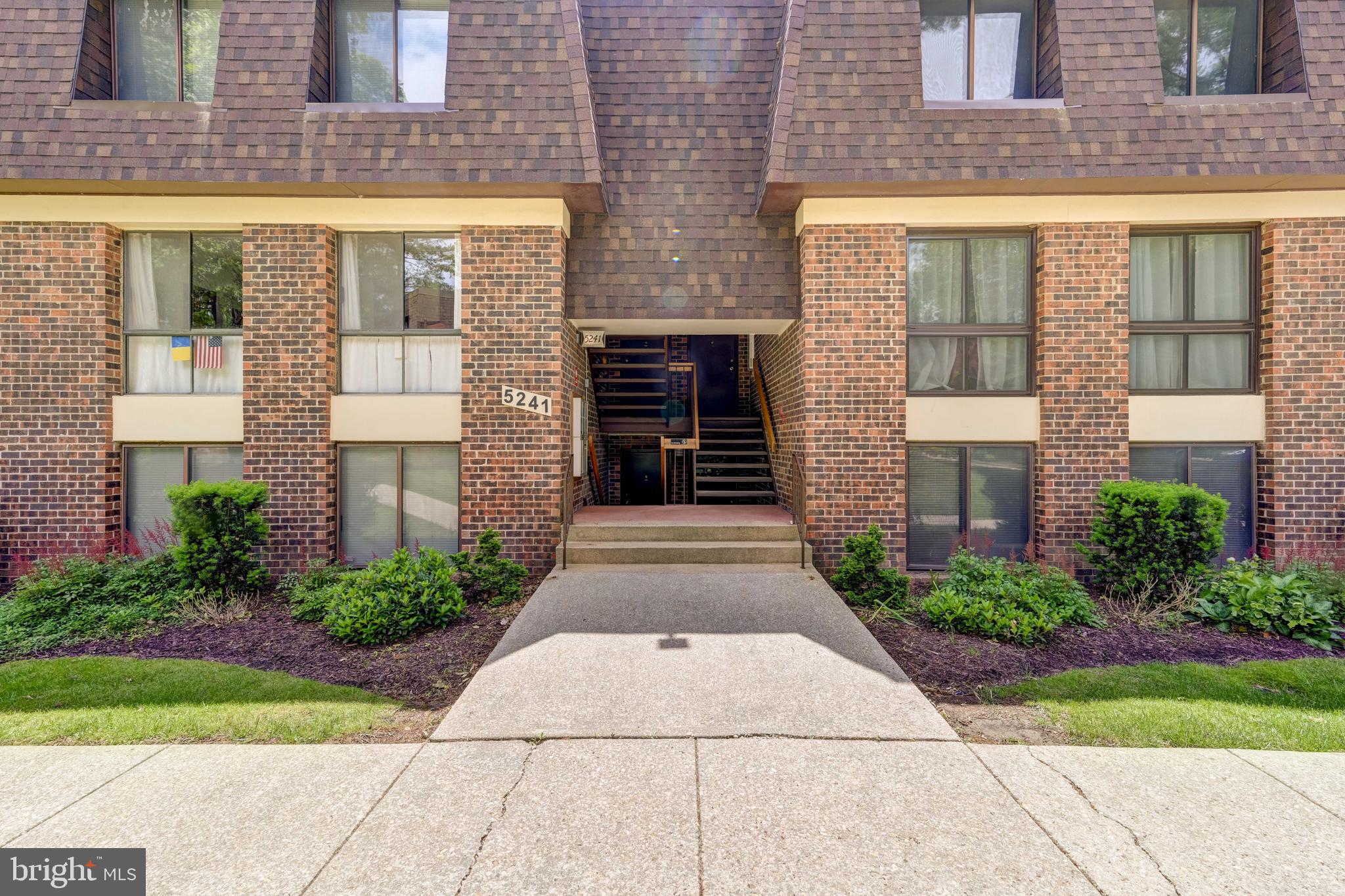 5241 West Running Brook Road, Unit 302 Columbia, MD 21044 - Photo 2 of 32 a front view of a brick building