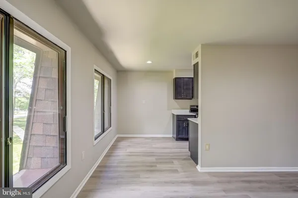 a view of a kitchen cabinets and wooden floor