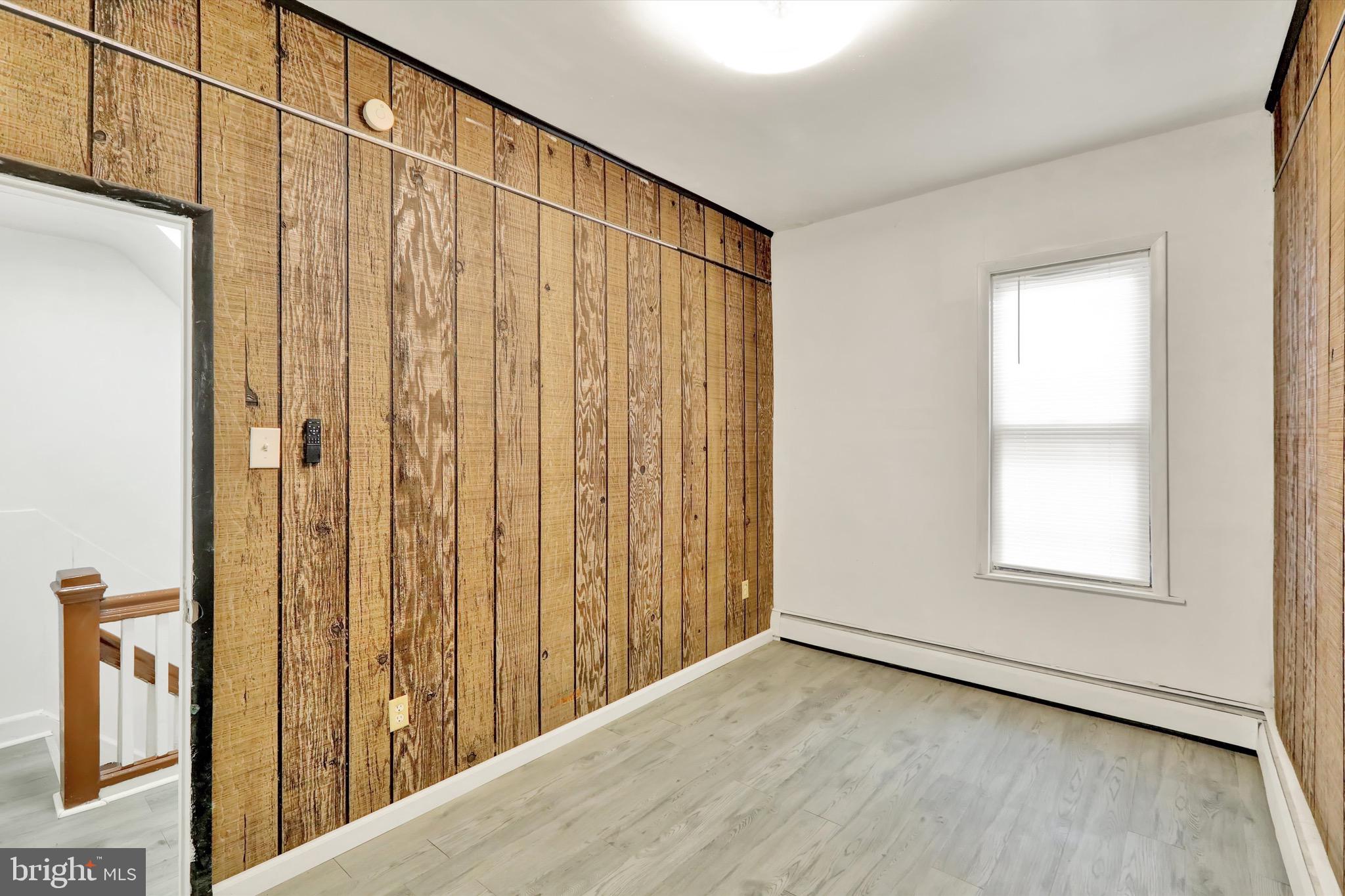 236 Wunder Street Reading, PA 19602 - Photo 12 of 27 an empty room with wooden floor and windows