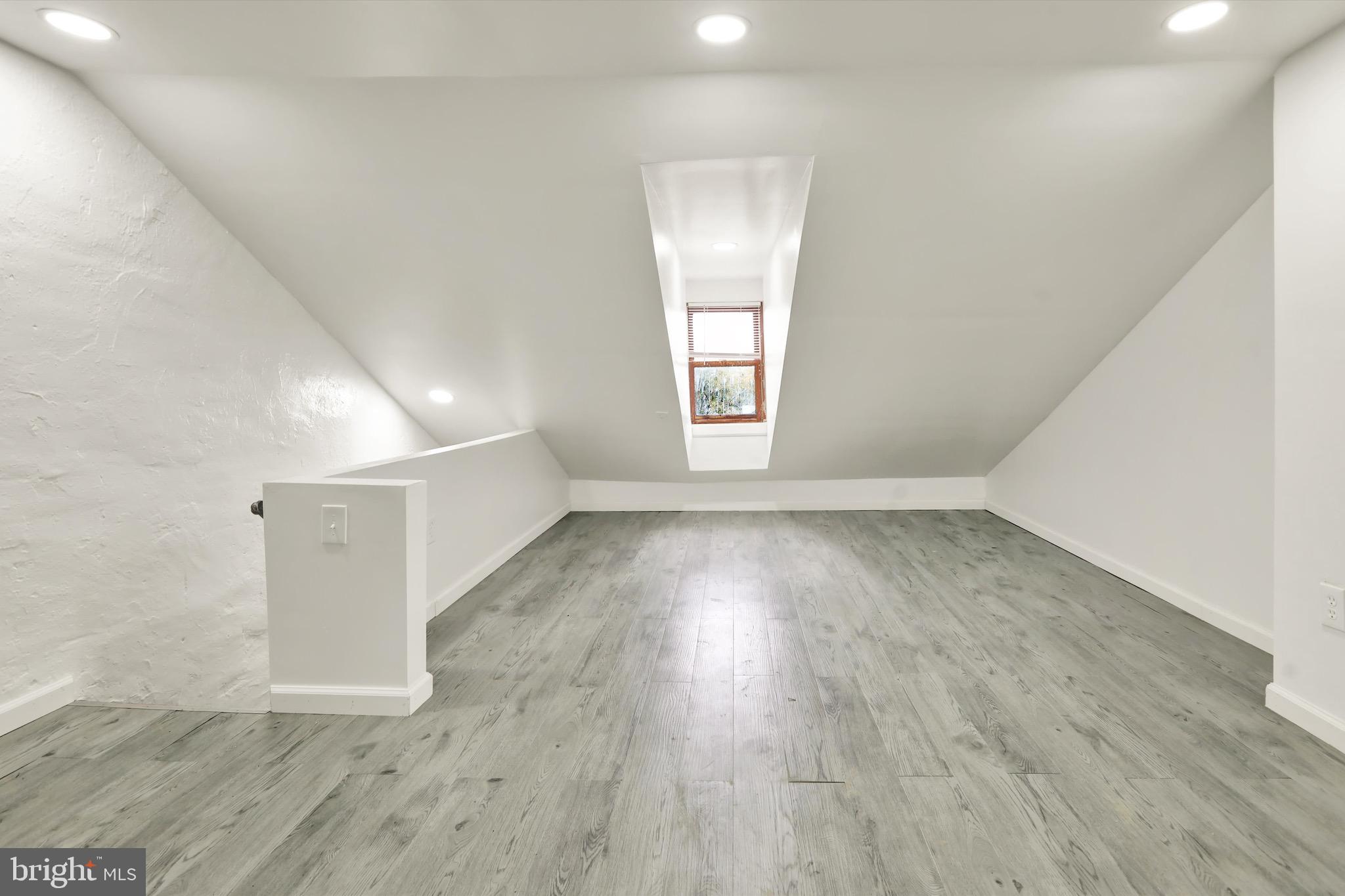 236 Wunder Street Reading, PA 19602 - Photo 21 of 27 an empty room with wooden floor and windows