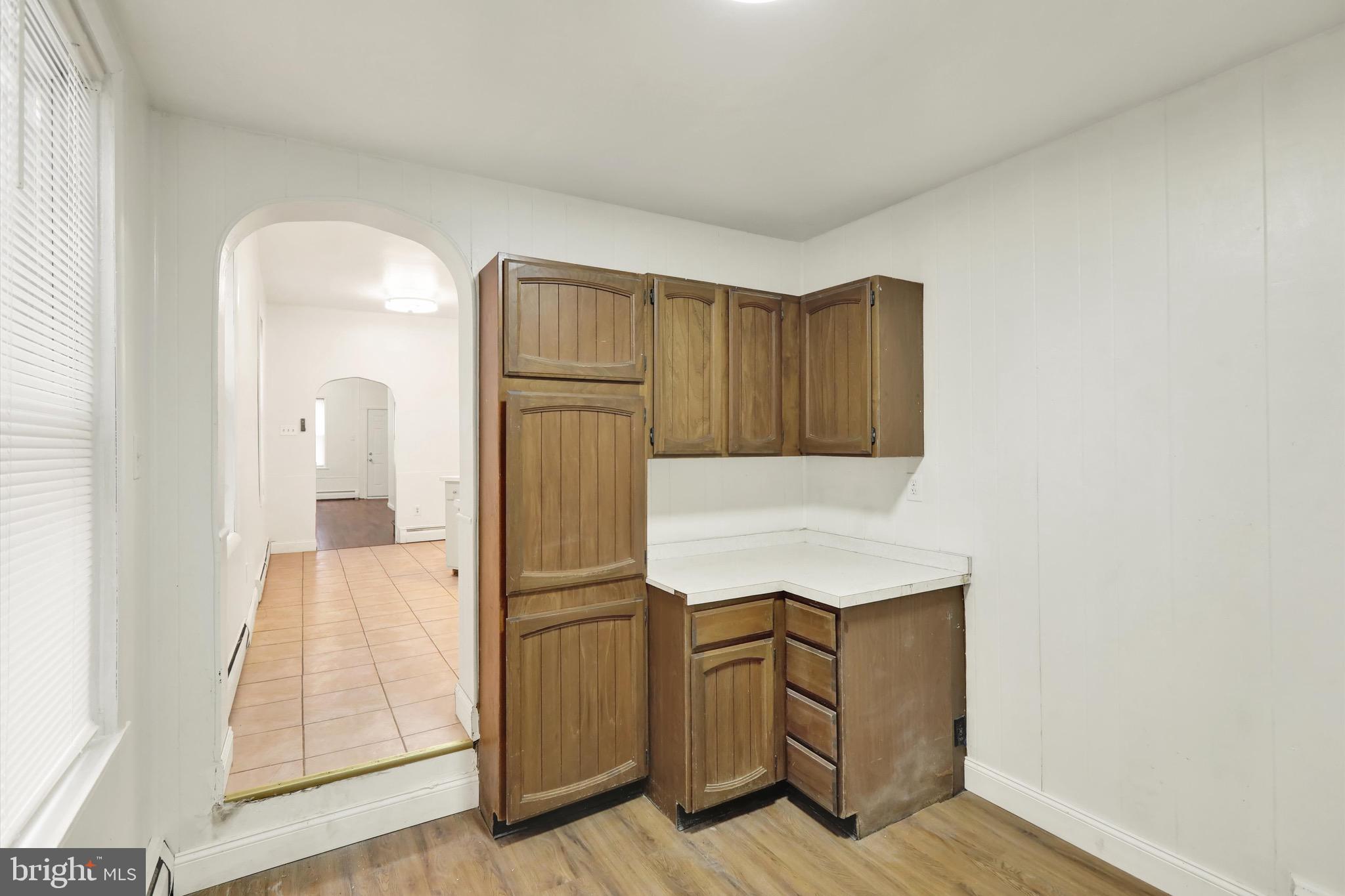 236 Wunder Street Reading, PA 19602 - Photo 10 of 27 a kitchen with cabinets and a wooden floor