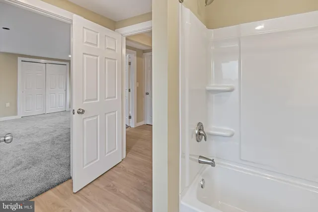 a bathroom with a bathtub and shower