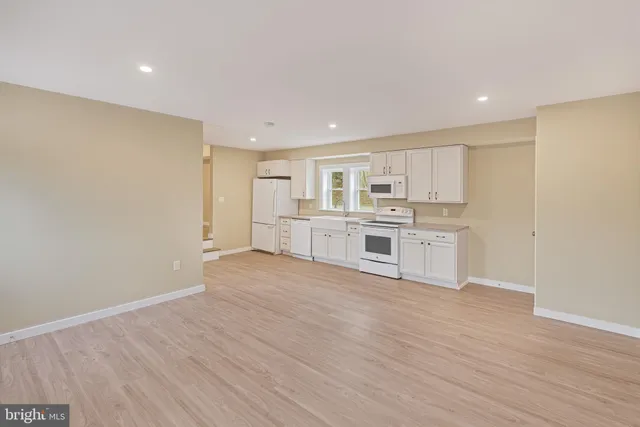 a view of kitchen with wooden floor