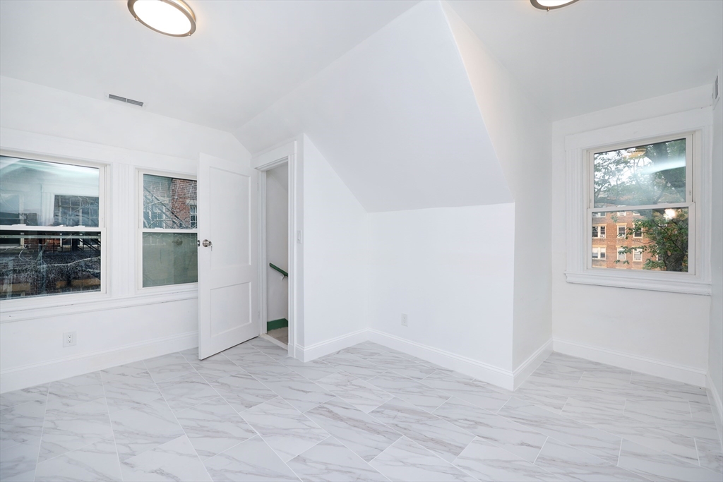 5 Chauncy Street, Unit 3 Cambridge, MA 02138 - Photo 4 of 11 wooden floor in an empty room