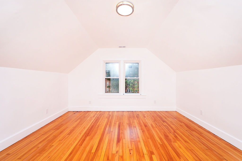 5 Chauncy Street, Unit 3 Cambridge, MA 02138 - Photo 7 of 11 a view of a room with wooden floor and white walls