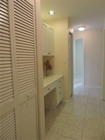 a bathroom with a shower and a sink