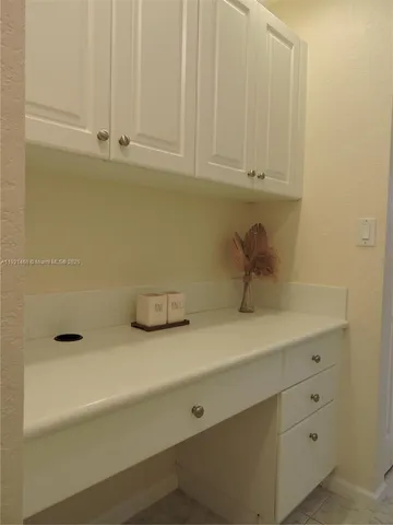 a bathroom with a sink and cabinets