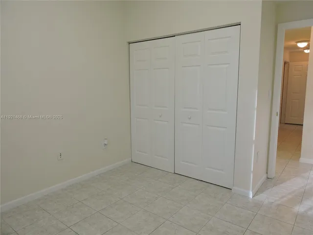 an empty room with closet area