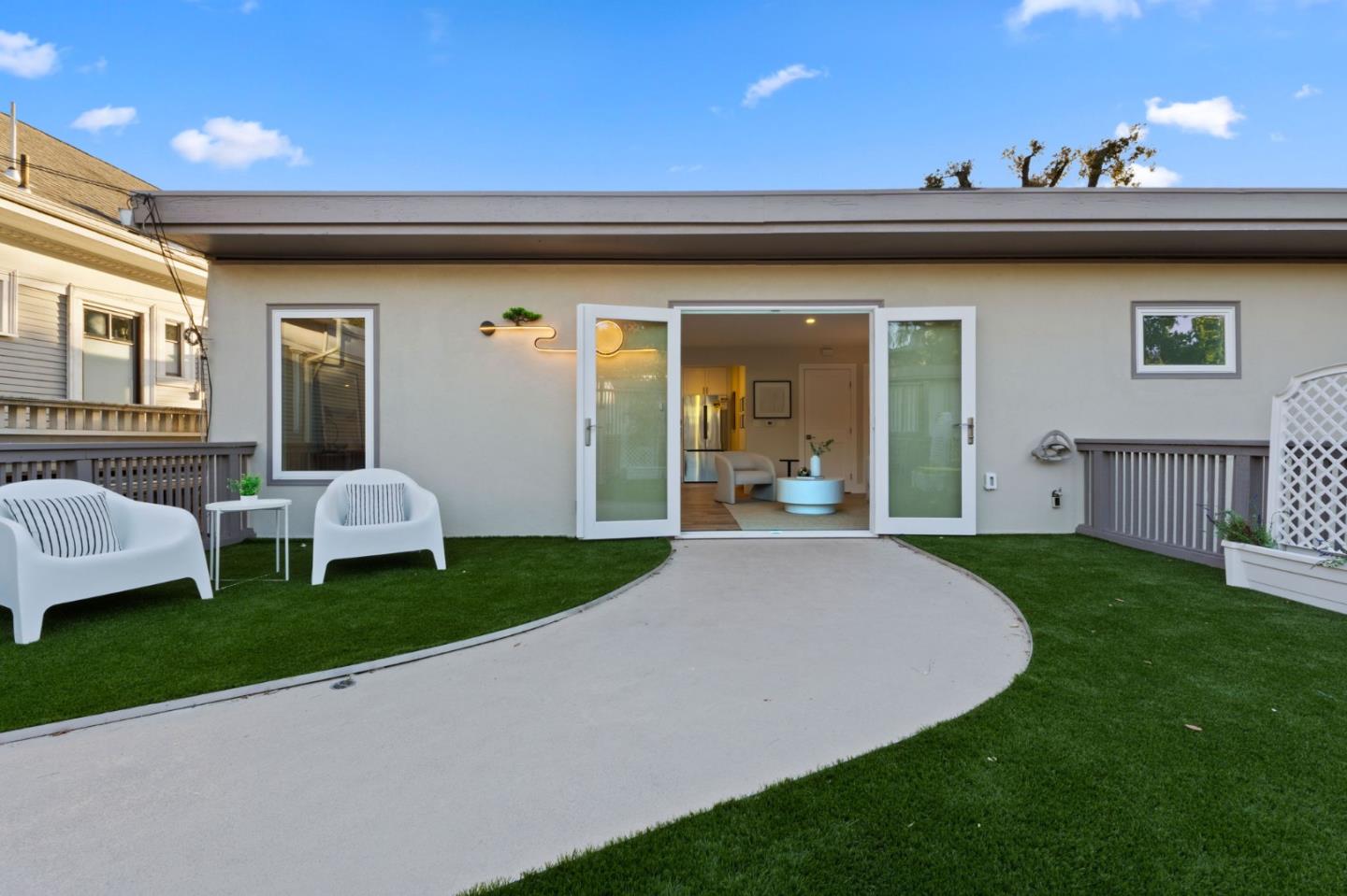 a view of a house with a porch and furniture