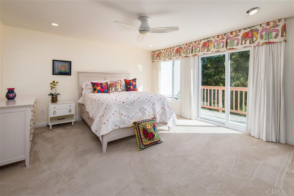 3016 Via De Caballo Encinitas, CA 92024 - Photo 10 of 14 Master bedroom with fireplace and view deck.