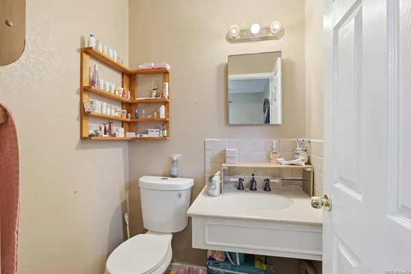 a bathroom with a sink and a toilet