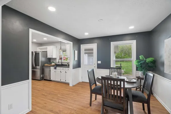a view of a dining room with furniture window and wooden floor