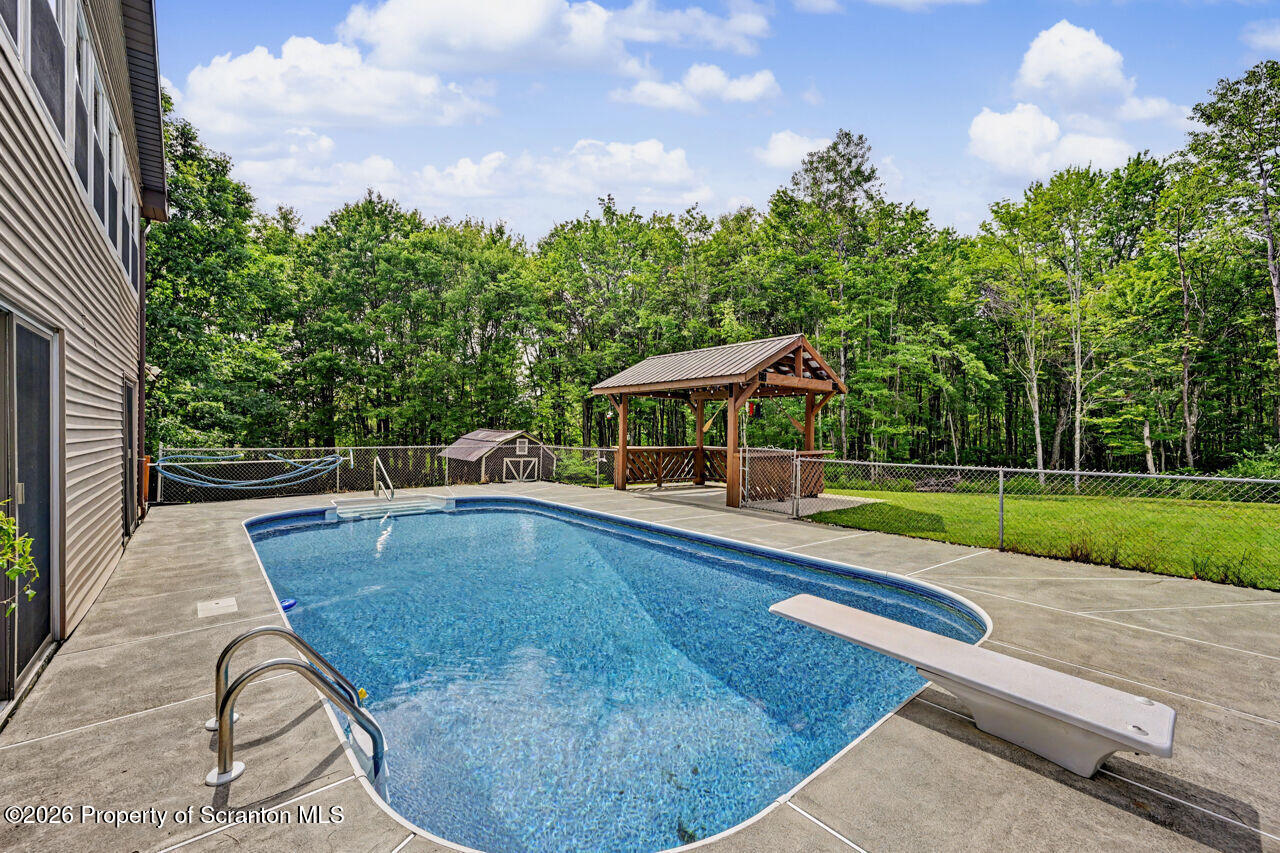 211 Buckingham Street Moscow, PA 18444 - Photo 71 of 83 a view of a swimming pool with a patio