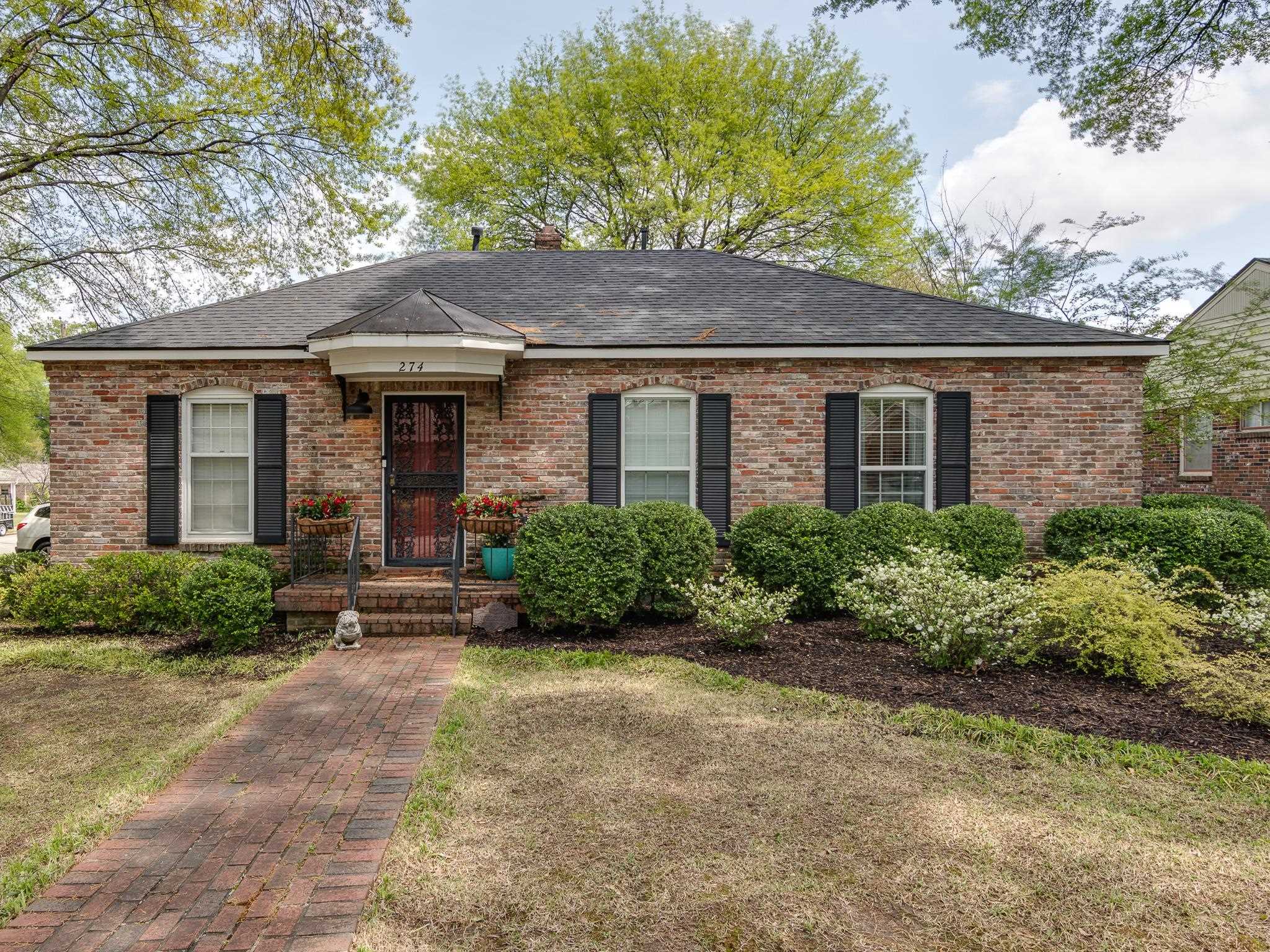 274 Montelo Road Memphis, TN 38120 - Photo 1 of 25 a front view of a house with a yard