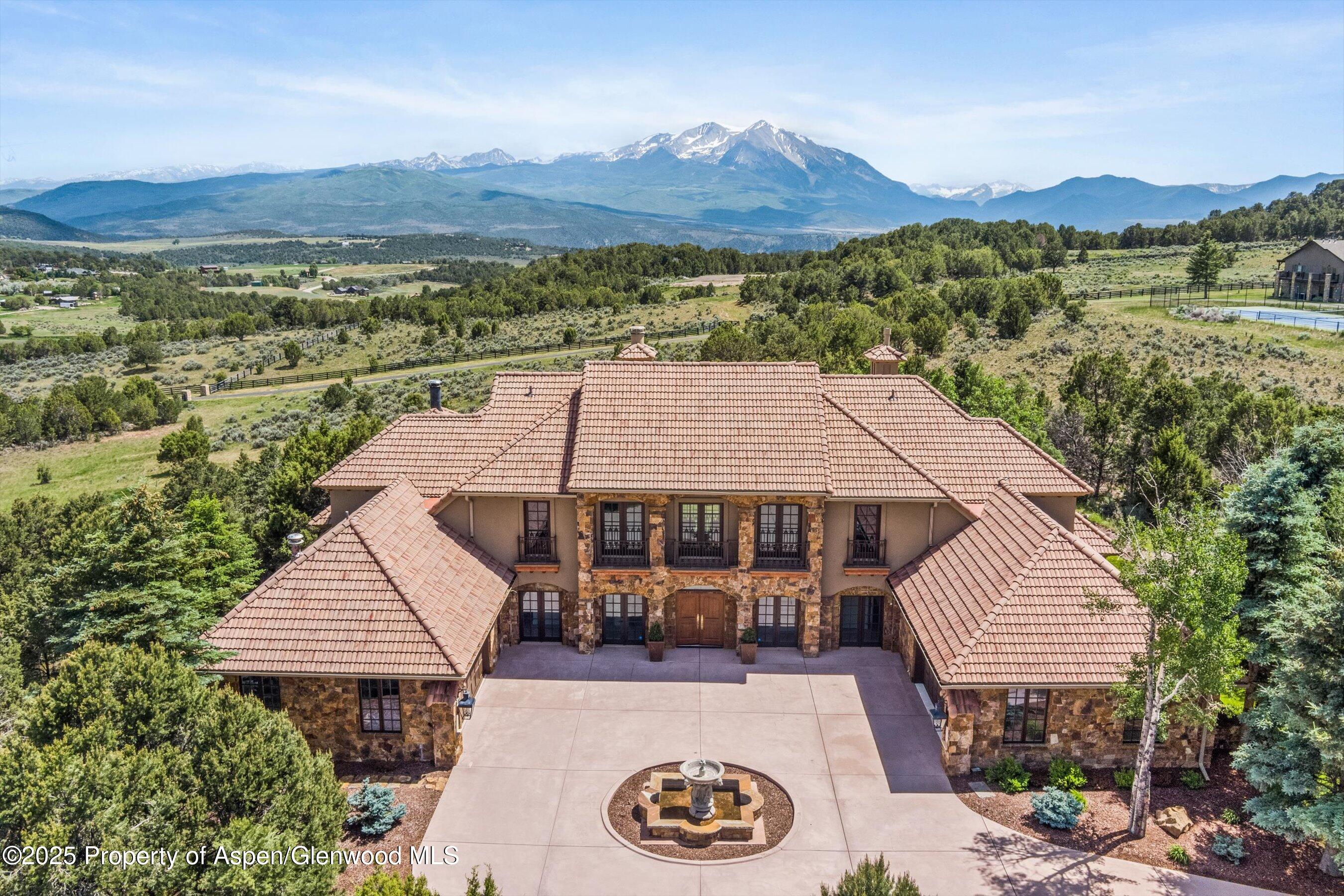 an aerial view of a house with a garden