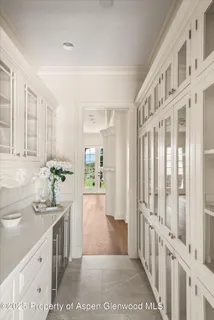 a bathroom with a sink a mirror and a shower