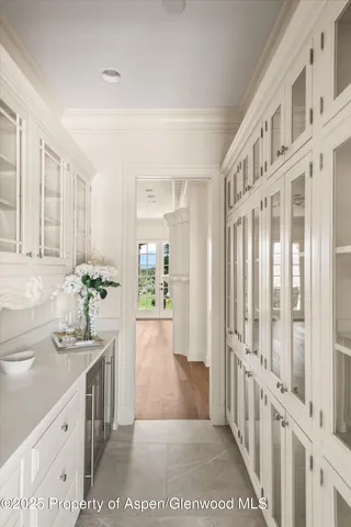 a bathroom with a sink a mirror and a shower