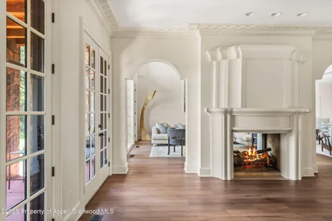 a view of a livingroom with furniture and a fireplace