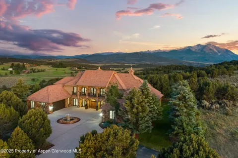 a view of house with outdoor space and mountain view