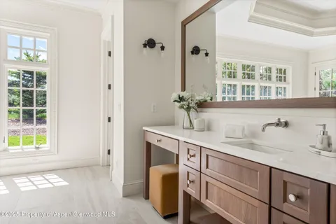 a bathroom with a sink and a window