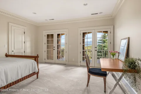 a bed room with a bed and a table