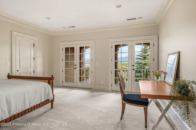 a bed room with a bed and a table