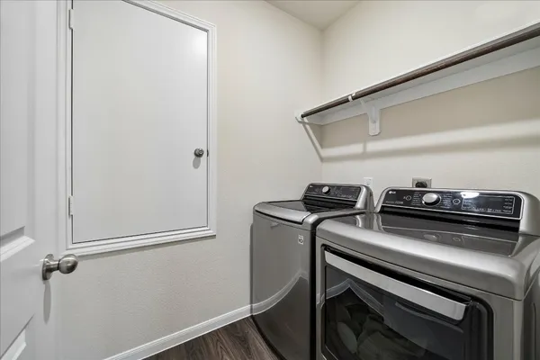 a view of appliances and wooden floor