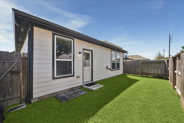 a house view with a garden space