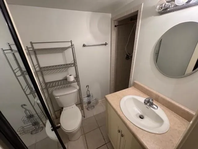 a bathroom with a sink toilet and mirror
