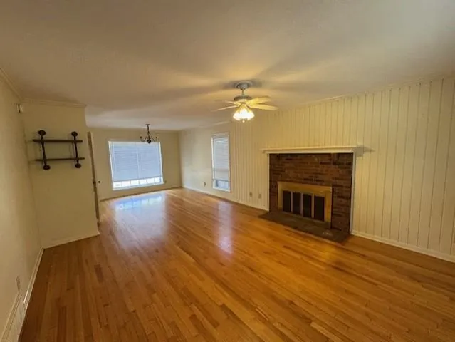 a kitchen with a sink a refrigerator and cabinets