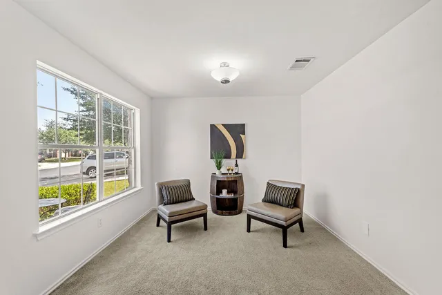 a living room with furniture and a window