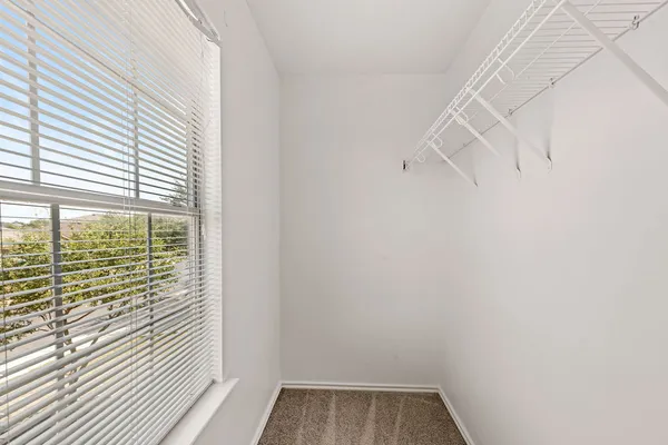 a view of a small space with racks on the wall