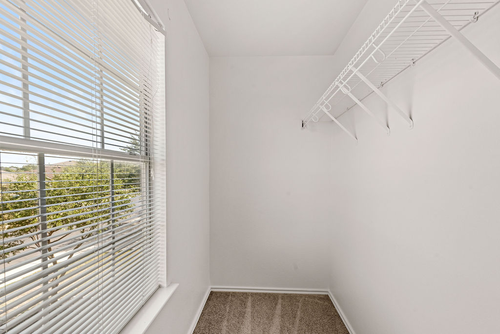 525 Meadow Park Drive Georgetown, TX 78626 - Photo 16 of 39 a view of a small space with racks on the wall