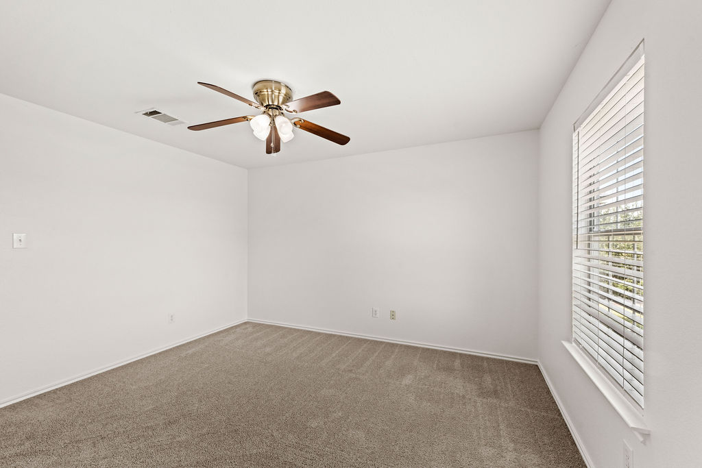 525 Meadow Park Drive Georgetown, TX 78626 - Photo 17 of 39 a view of a room with a ceiling fan and window