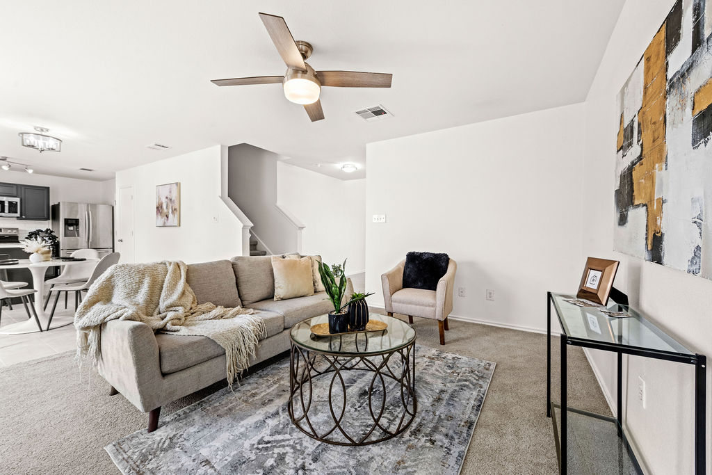 525 Meadow Park Drive Georgetown, TX 78626 - Photo 3 of 39 a living room with furniture a rug and white walls