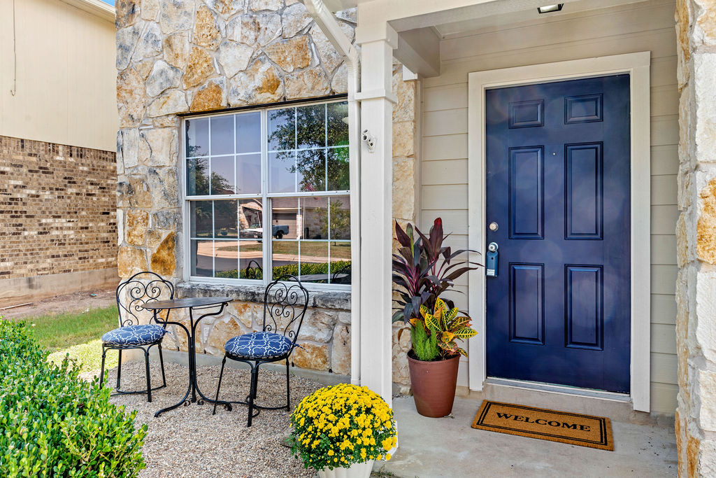 525 Meadow Park Drive Georgetown, TX 78626 - Photo 31 of 39 a front view of a house with outdoor seating and potted plants