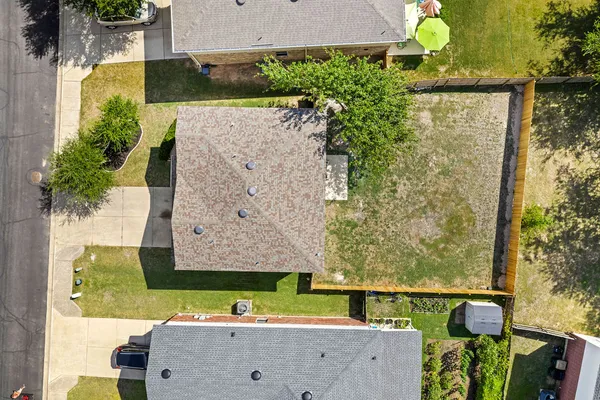 an aerial view of a house with a garden