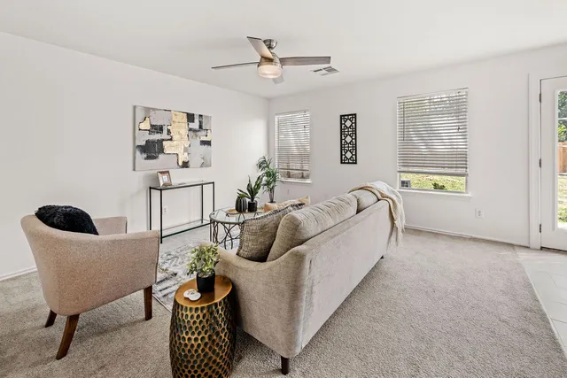 a living room with furniture and a window