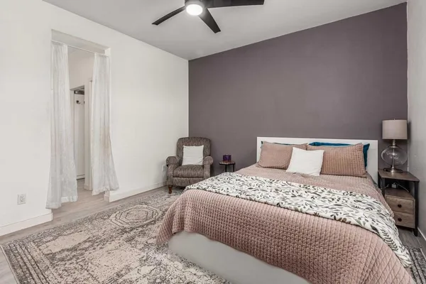 a bedroom with a bed and a dresser