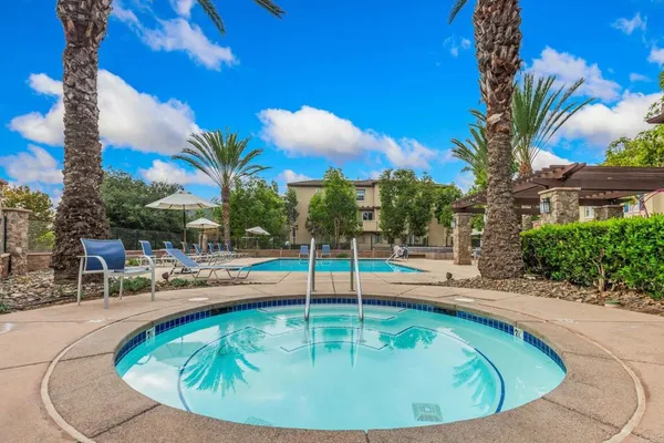 a view of a swimming pool with a lounge chairs