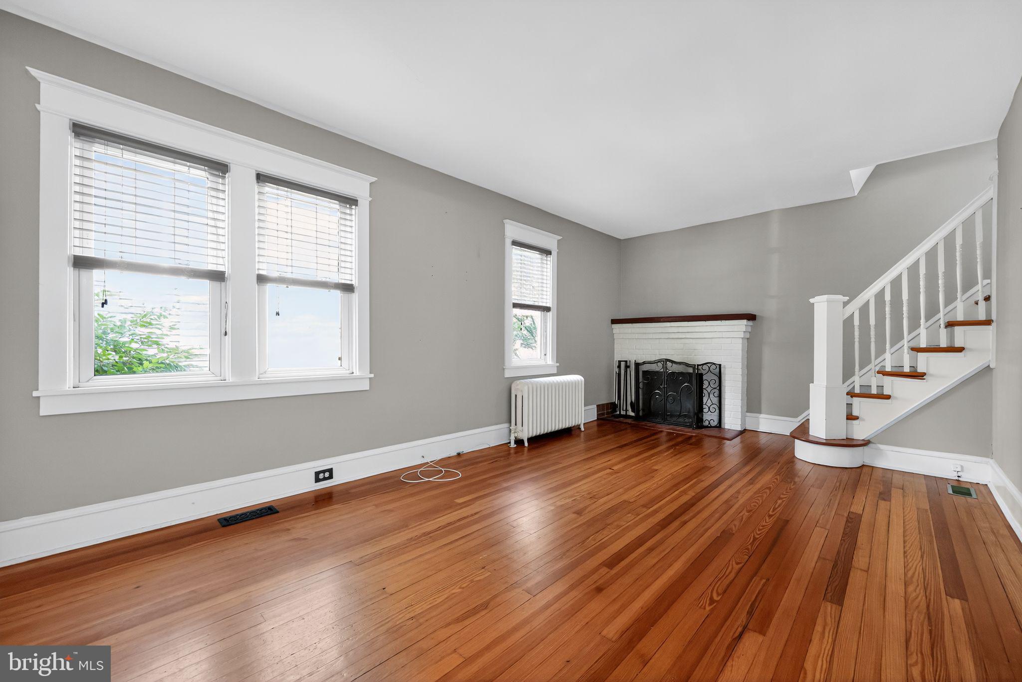 159 Wayne Avenue Haddonfield, NJ 08033 - Photo 12 of 30 a view of a livingroom with wooden floor and a fireplace