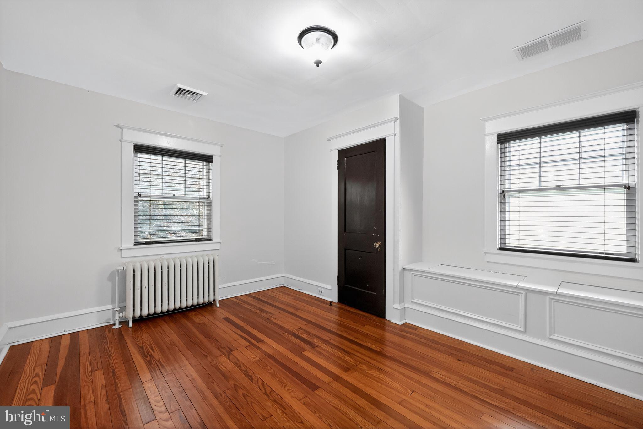 159 Wayne Avenue Haddonfield, NJ 08033 - Photo 16 of 30 wooden floor in an empty room with a window