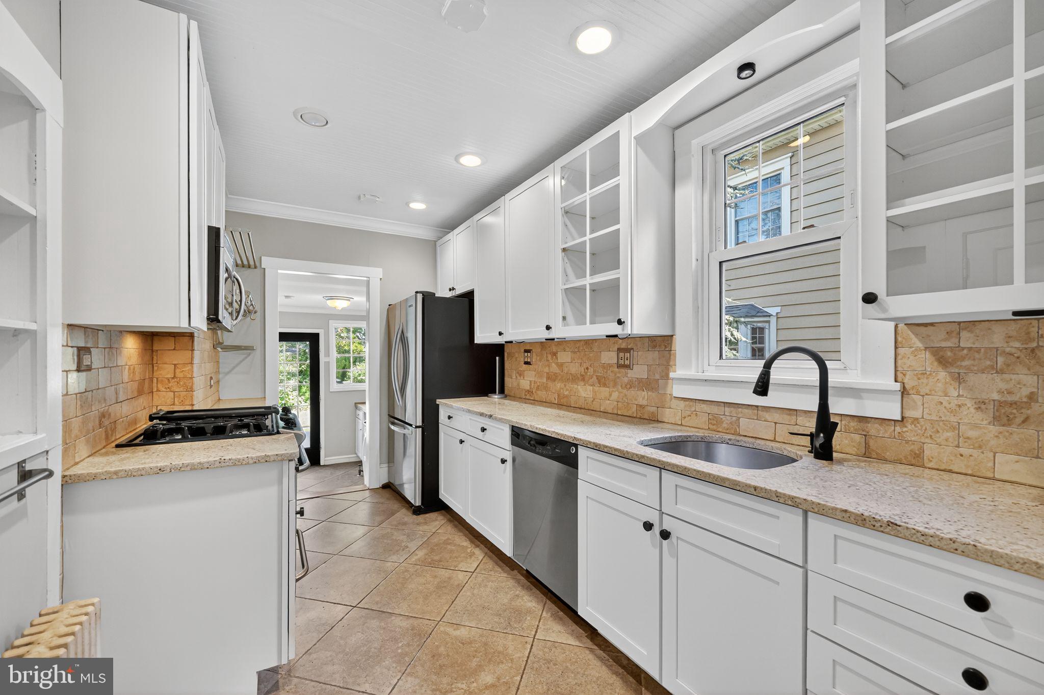 159 Wayne Avenue Haddonfield, NJ 08033 - Photo 17 of 30 a kitchen with white cabinets and appliances