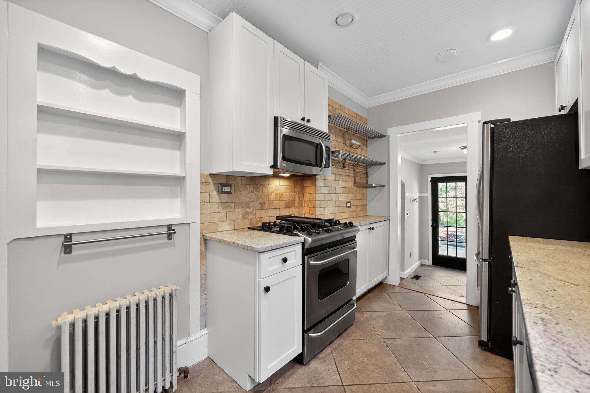 159 Wayne Avenue Haddonfield, NJ 08033 - Photo 18 of 30 a kitchen with a stove microwave and refrigerator