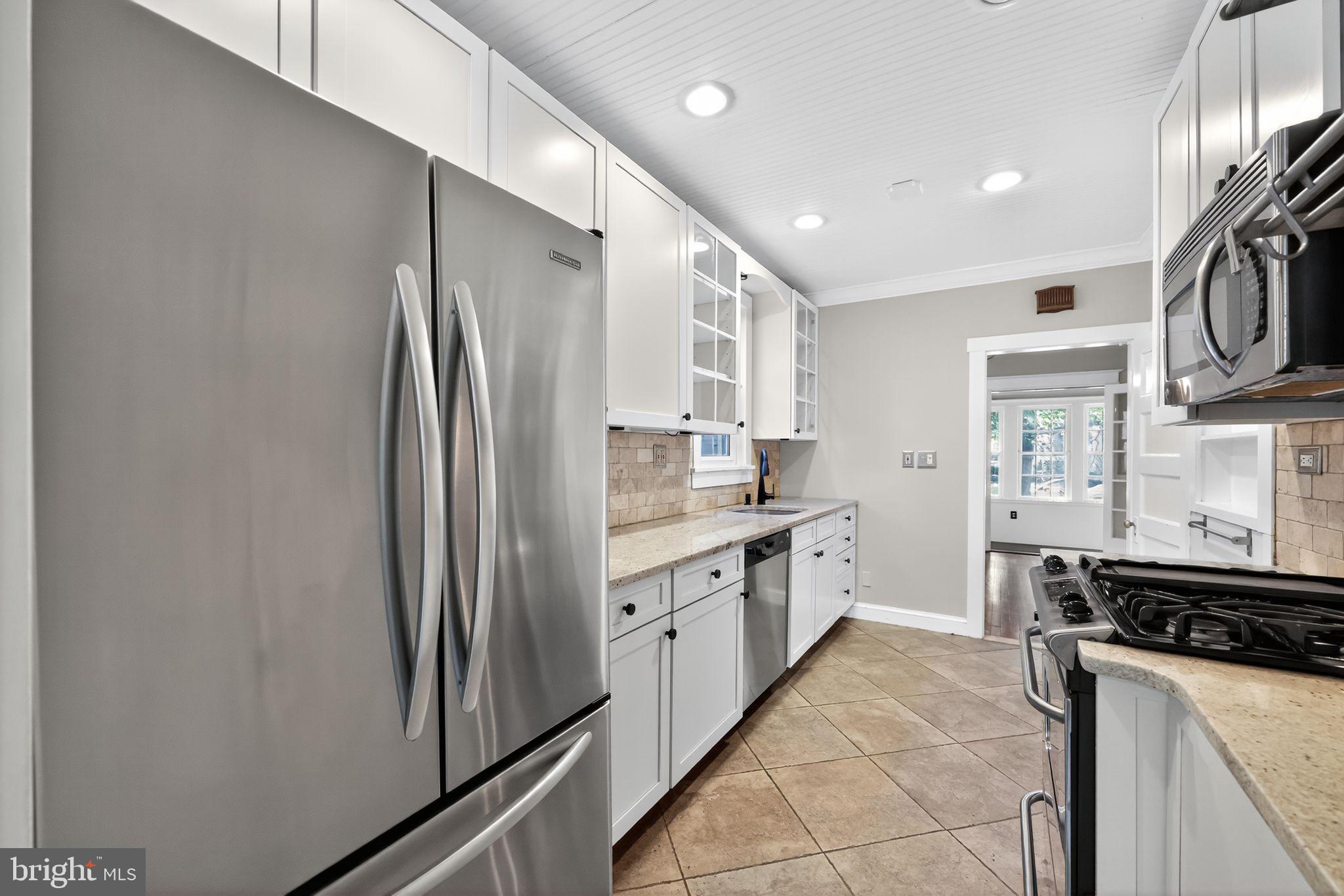 159 Wayne Avenue Haddonfield, NJ 08033 - Photo 19 of 30 a kitchen with stainless steel appliances granite countertop a refrigerator a stove and a sink