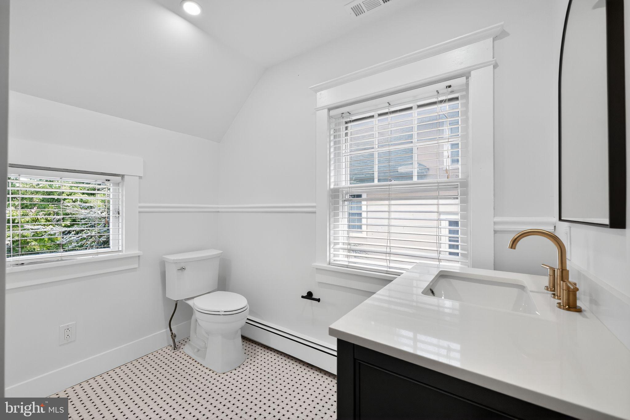 159 Wayne Avenue Haddonfield, NJ 08033 - Photo 21 of 30 a bathroom with a sink a toilet and a window