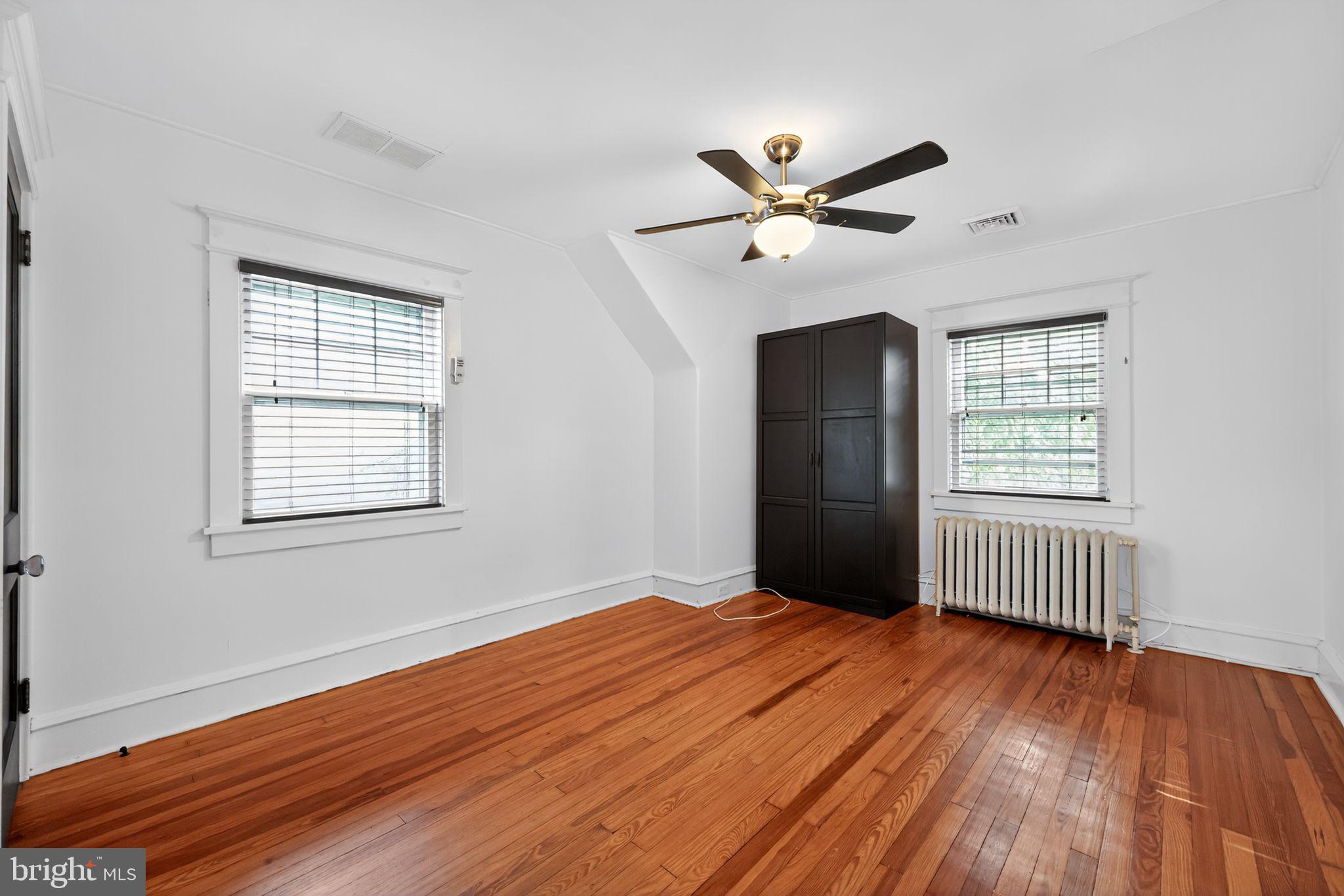 159 Wayne Avenue Haddonfield, NJ 08033 - Photo 24 of 30 a view of an empty room with wooden floor and a window