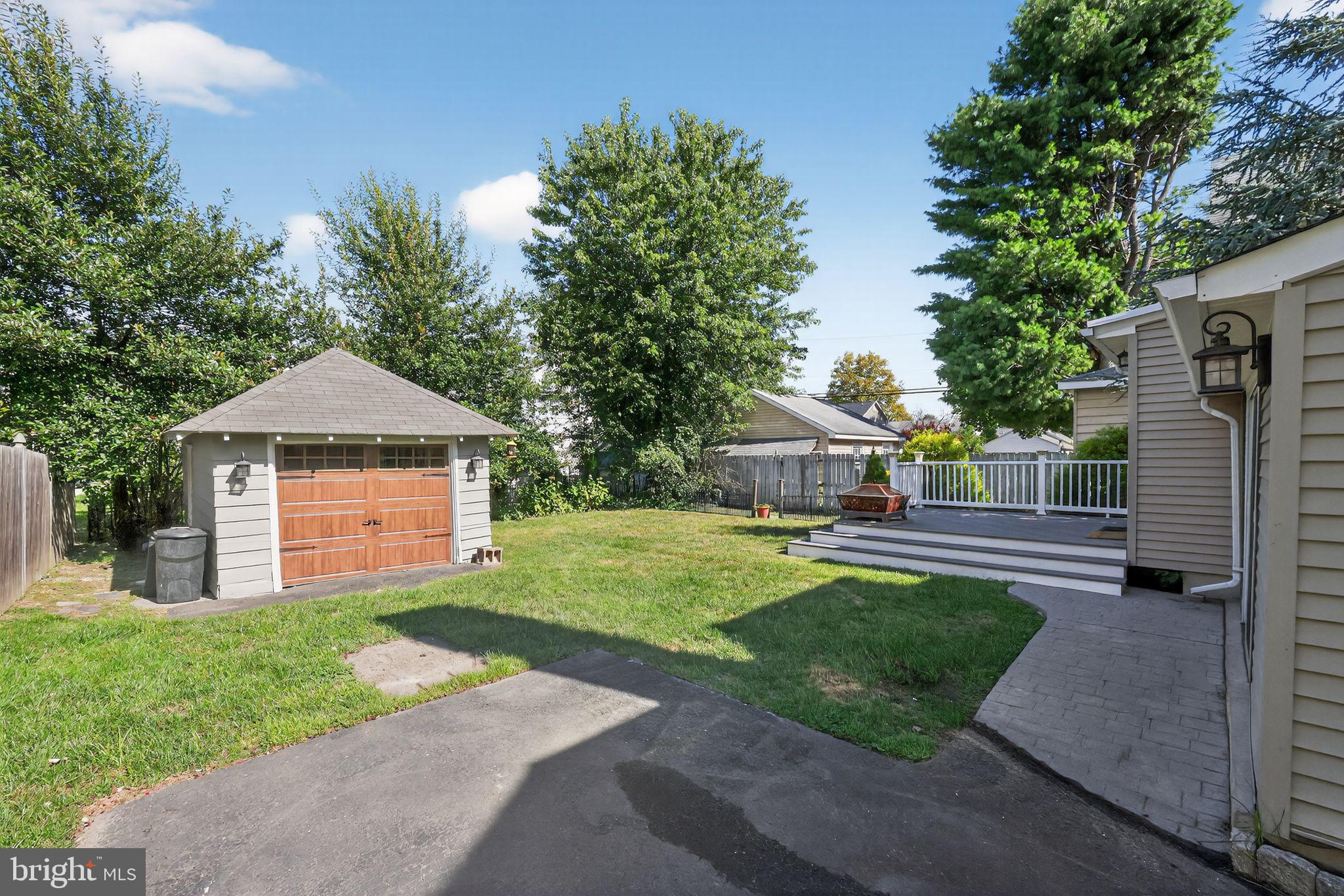 159 Wayne Avenue Haddonfield, NJ 08033 - Photo 30 of 30 a front view of a house with a yard and garage